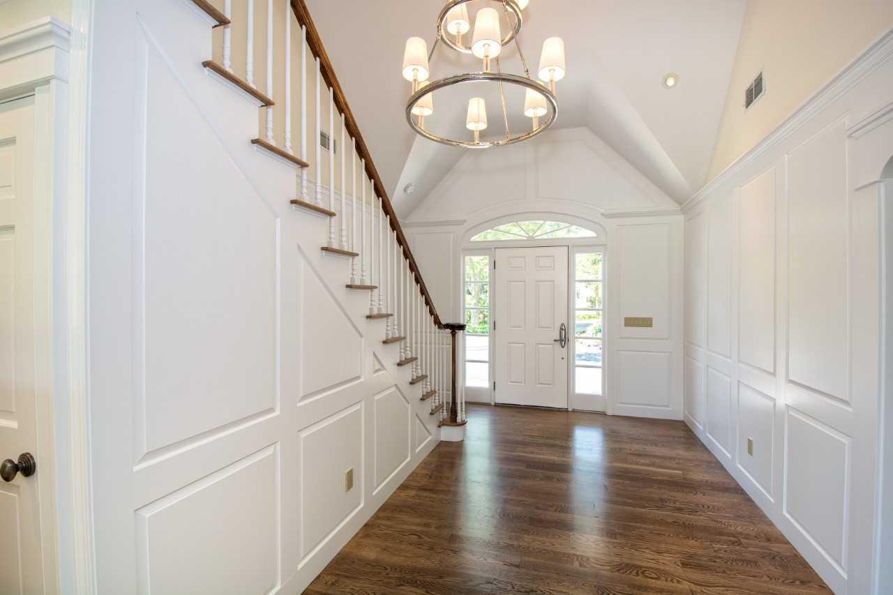 140 Pineleigh Path Osterville, MA 02655 - Photo 4 of 29 a view of a hallway with wooden floor and staircase