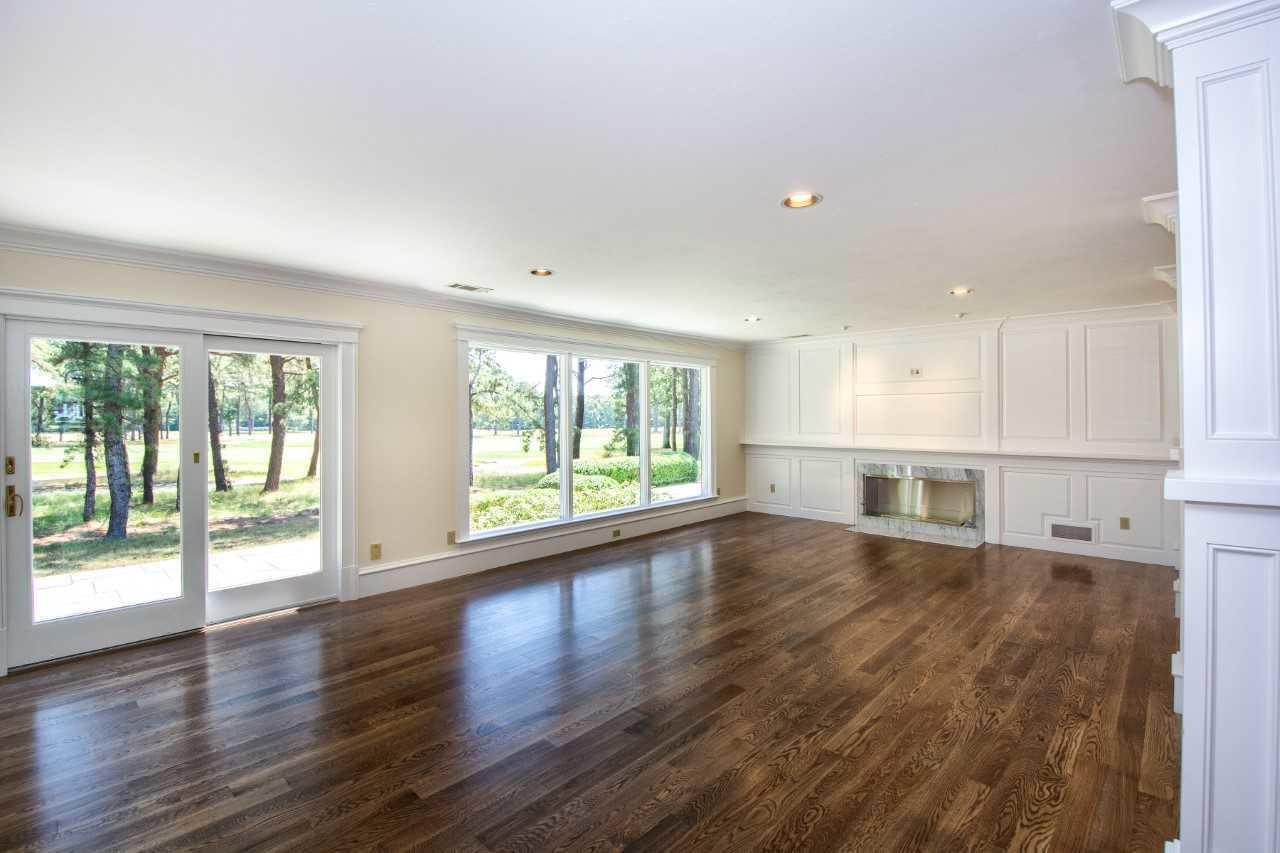 140 Pineleigh Path Osterville, MA 02655 - Photo 6 of 29 a view of an empty room with wooden floor and a window