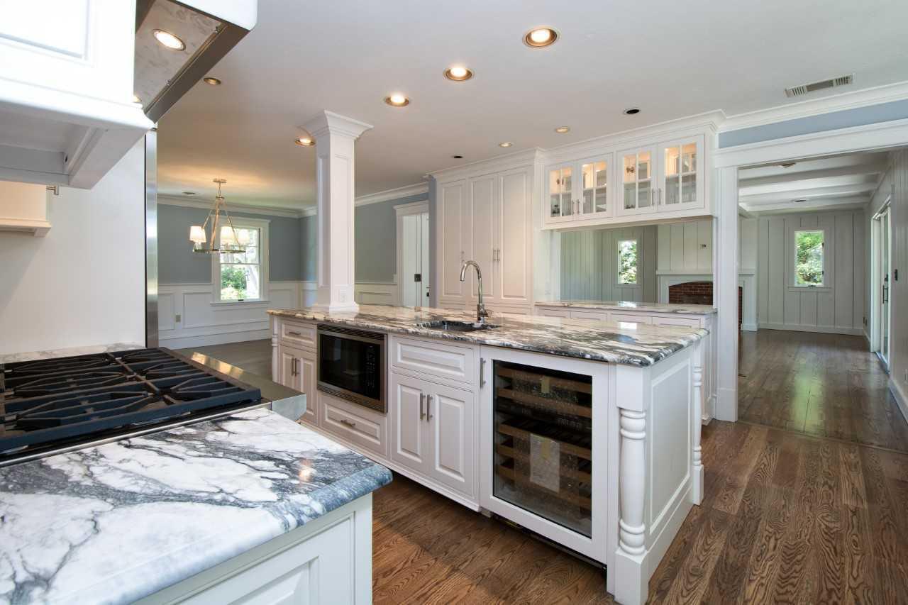 140 Pineleigh Path Osterville, MA 02655 - Photo 9 of 29 a kitchen with a stove and a wooden floor