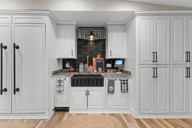 a bedroom with bed and wooden floor