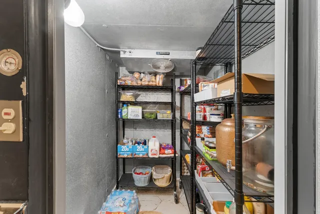 a bathroom with a granite countertop sink mirror vanity and toilet