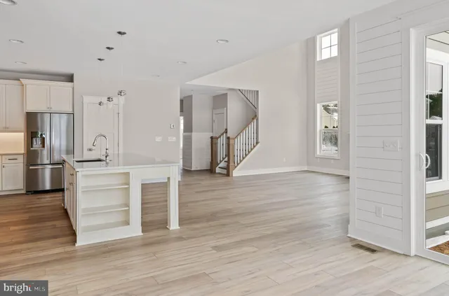 a view of kitchen and wooden floor