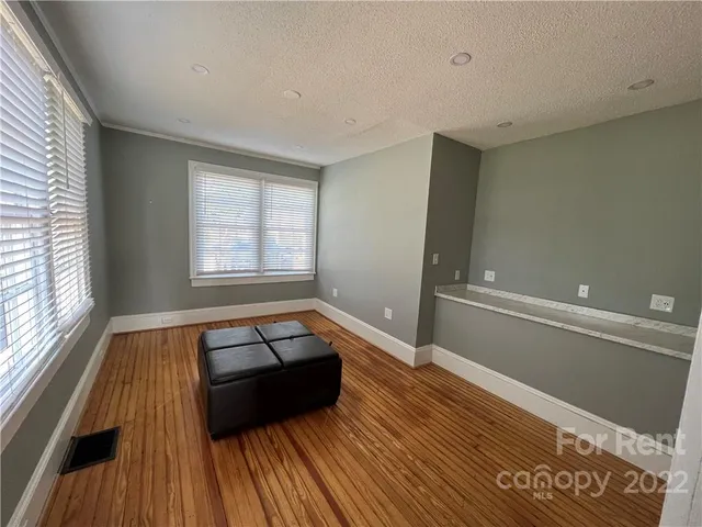 a room with a bed and a window