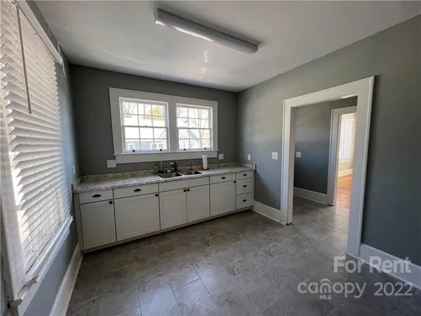 a large white room with window