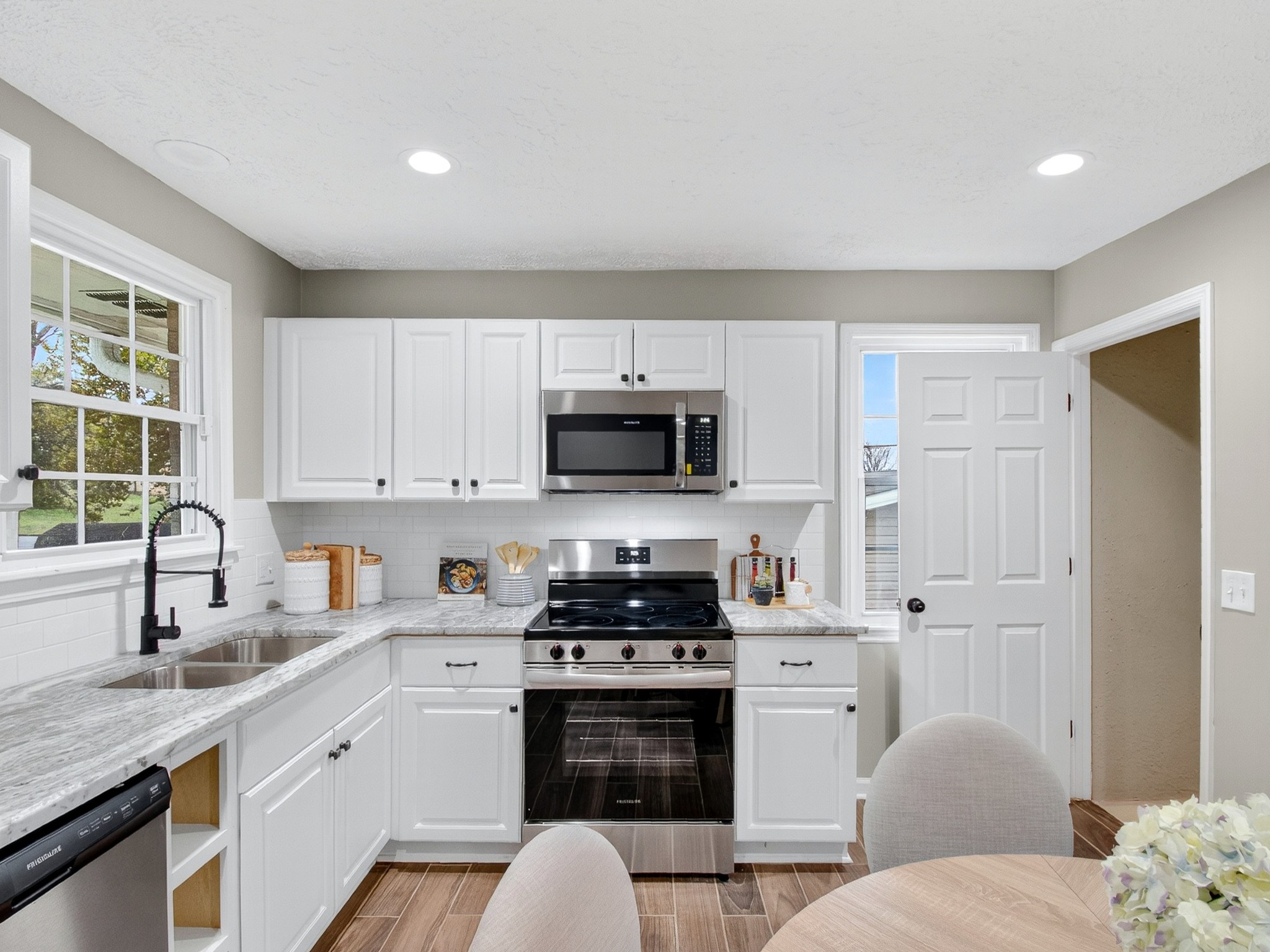 2509 Old Matthews Road Nashville, TN 37207 - Photo 15 of 45 a kitchen with stainless steel appliances a stove sink and cabinets