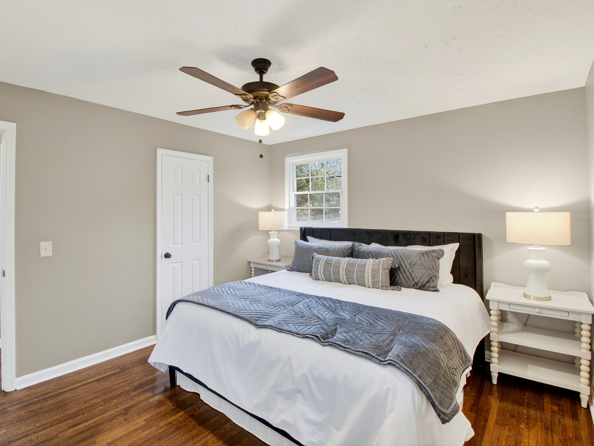 2509 Old Matthews Road Nashville, TN 37207 - Photo 20 of 45 a spacious bedroom with a bed and a ceiling fan