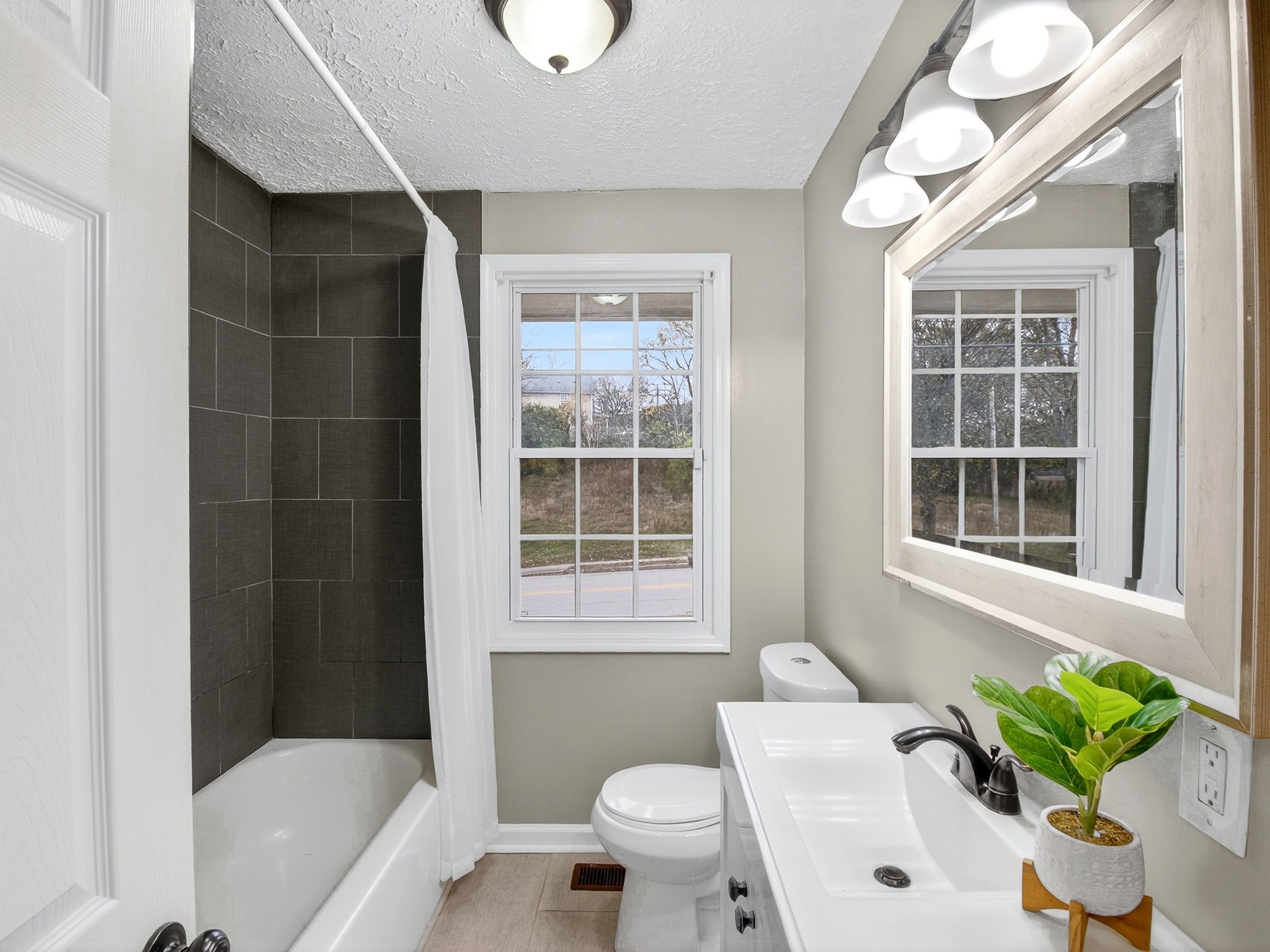 2509 Old Matthews Road Nashville, TN 37207 - Photo 29 of 45 a bathroom with a toilet tub and shower