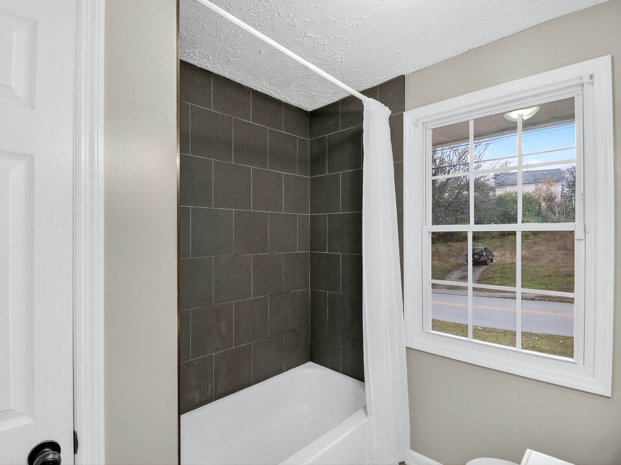 2509 Old Matthews Road Nashville, TN 37207 - Photo 30 of 45 a bathroom with a bathtub and a shower