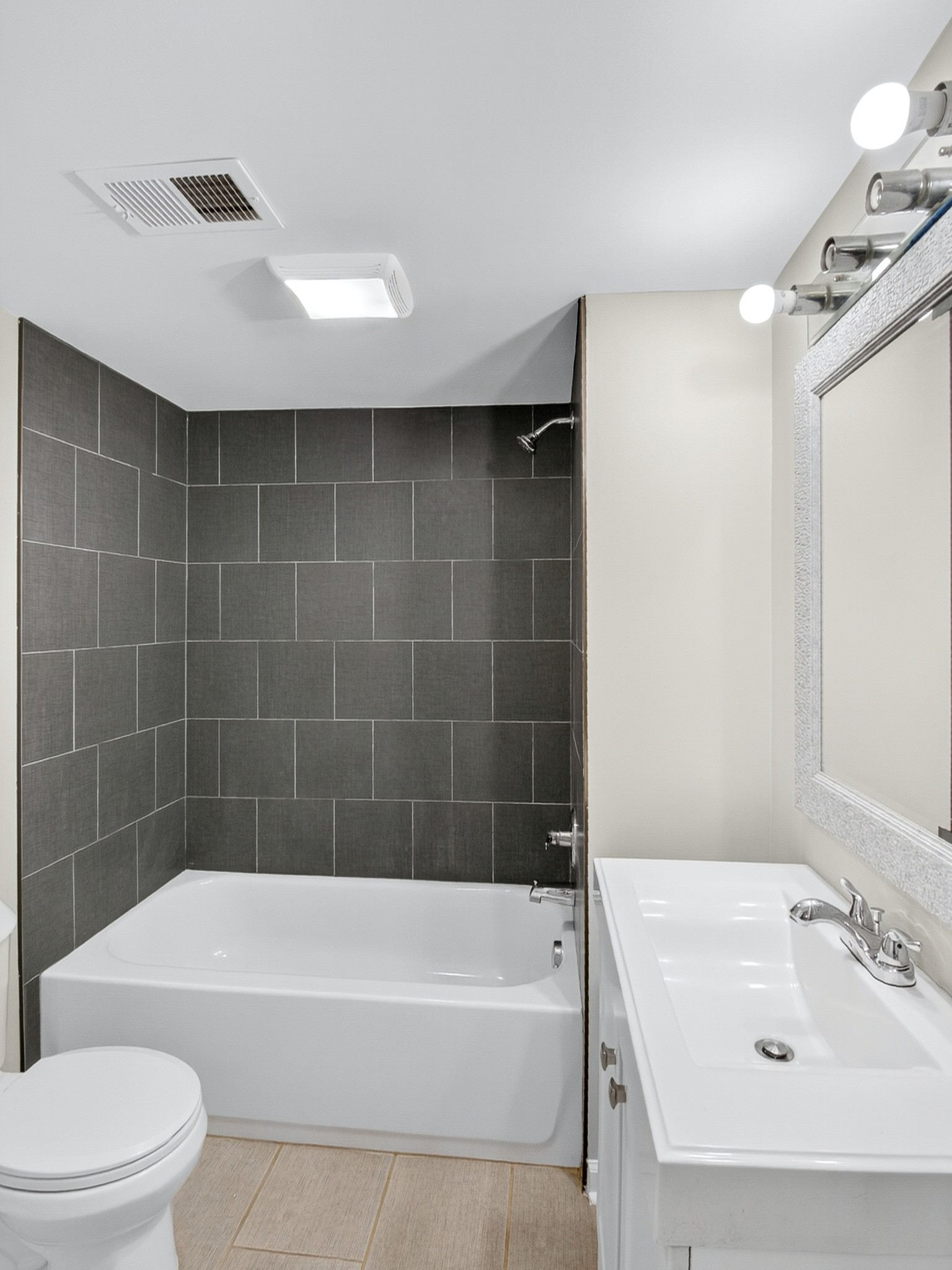 2509 Old Matthews Road Nashville, TN 37207 - Photo 34 of 45 a bathroom with a bathtub shower sink vanity and toilet