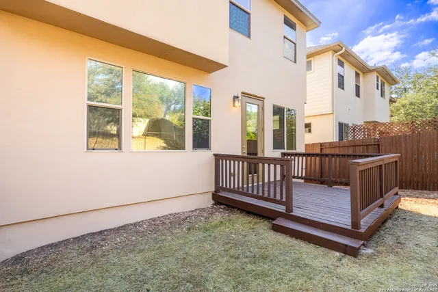 a view of a porch with wooden fence
