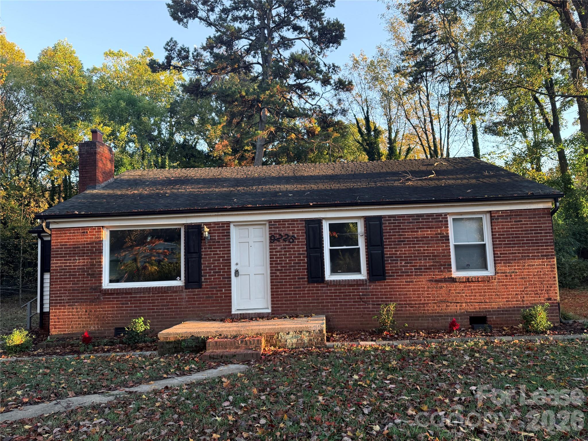 9225 Moores Chapel Road Charlotte, NC 28214 - Photo 2 of 19 a front view of a house with a garden
