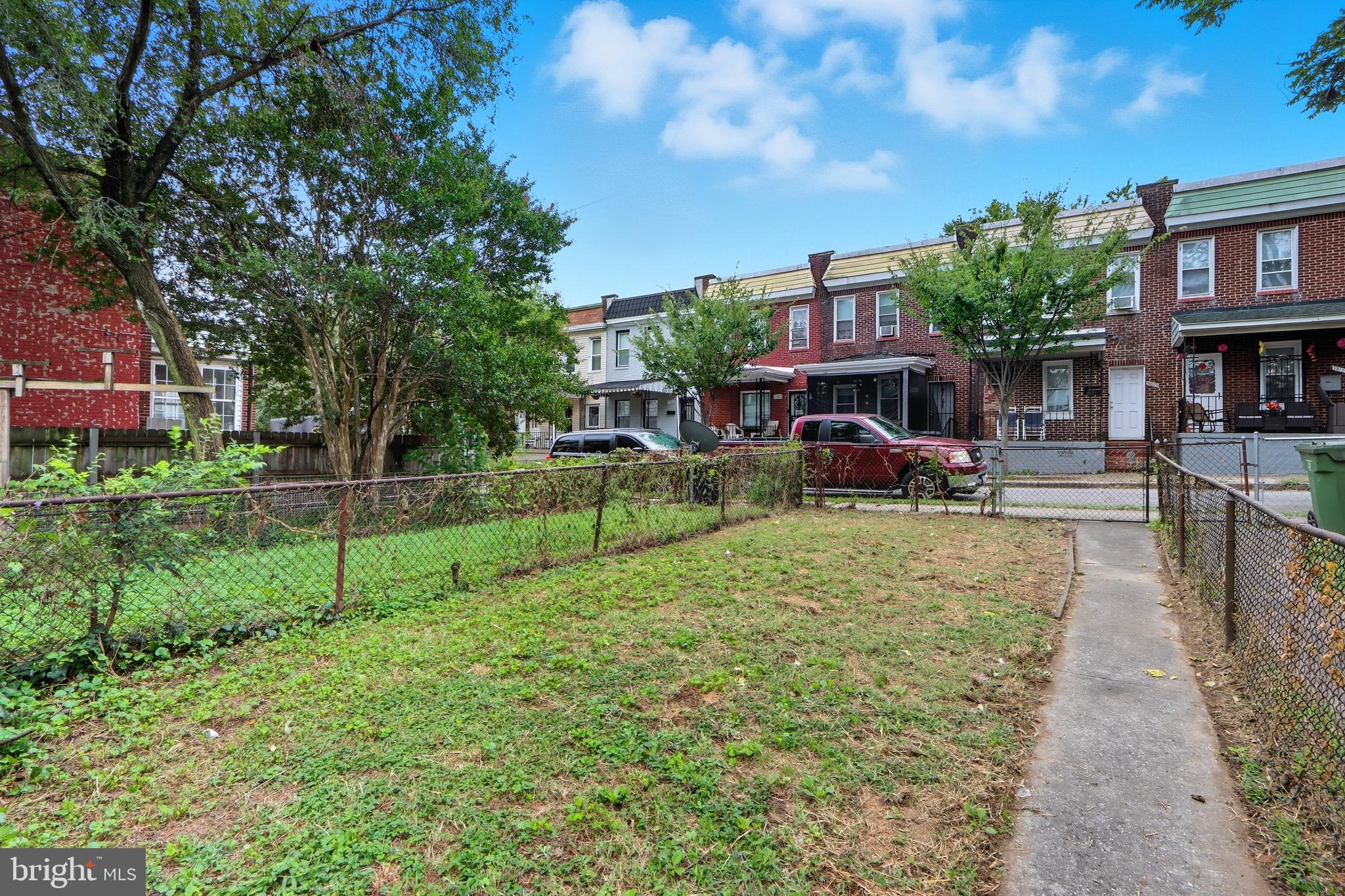 1309 East Patapsco Avenue Baltimore, MD 21225 - Photo 24 of 34 a view of a house with a yard