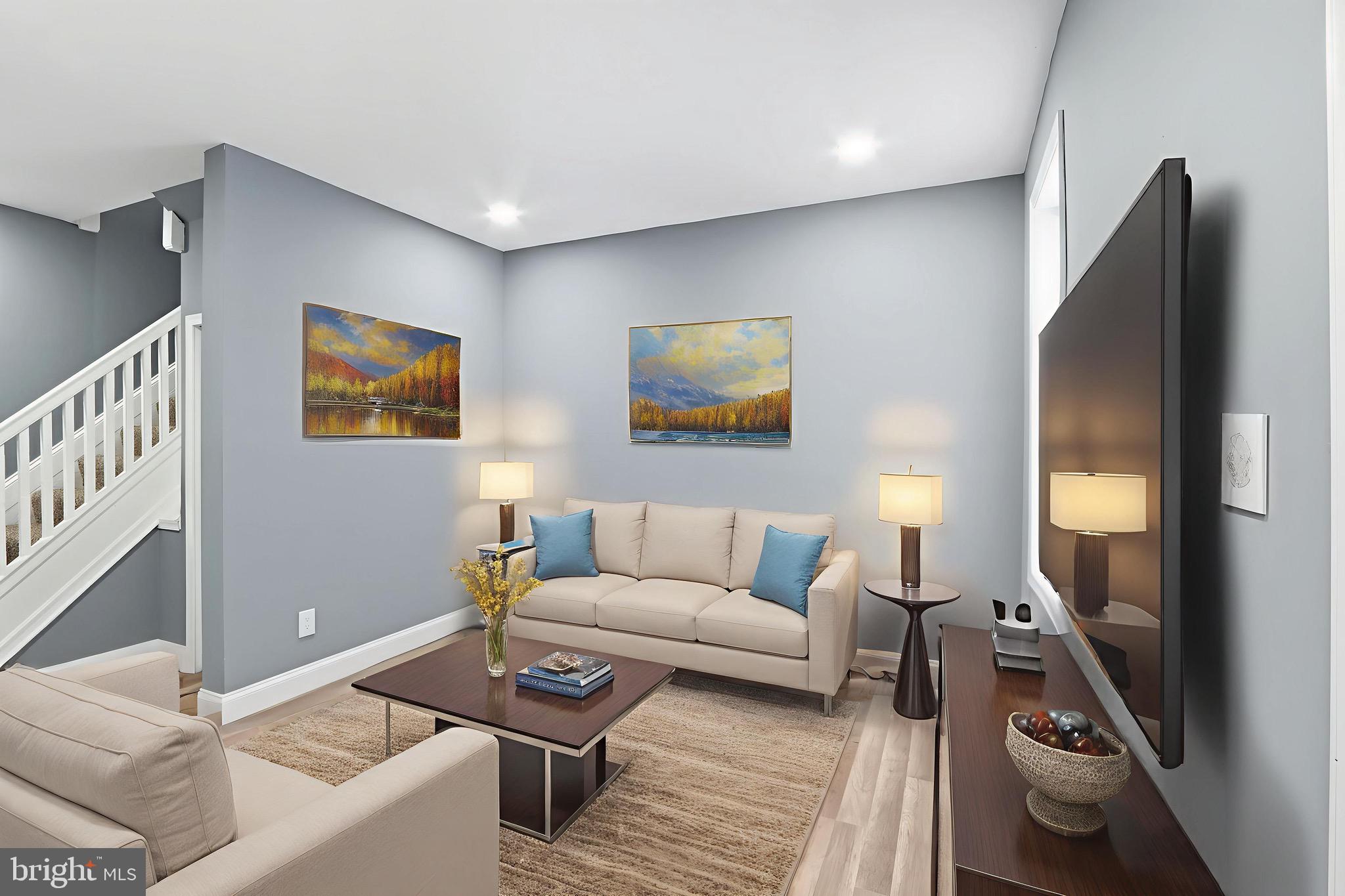 1309 East Patapsco Avenue Baltimore, MD 21225 - Photo 28 of 34 a living room with furniture and a flat screen tv