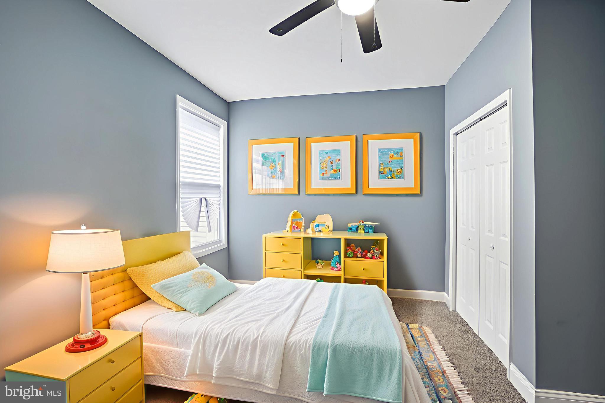 1309 East Patapsco Avenue Baltimore, MD 21225 - Photo 32 of 34 a bedroom with a bed and a lamp on dresser next to a window