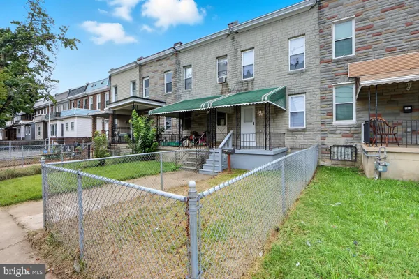 a view of a house with swimming pool and a porch