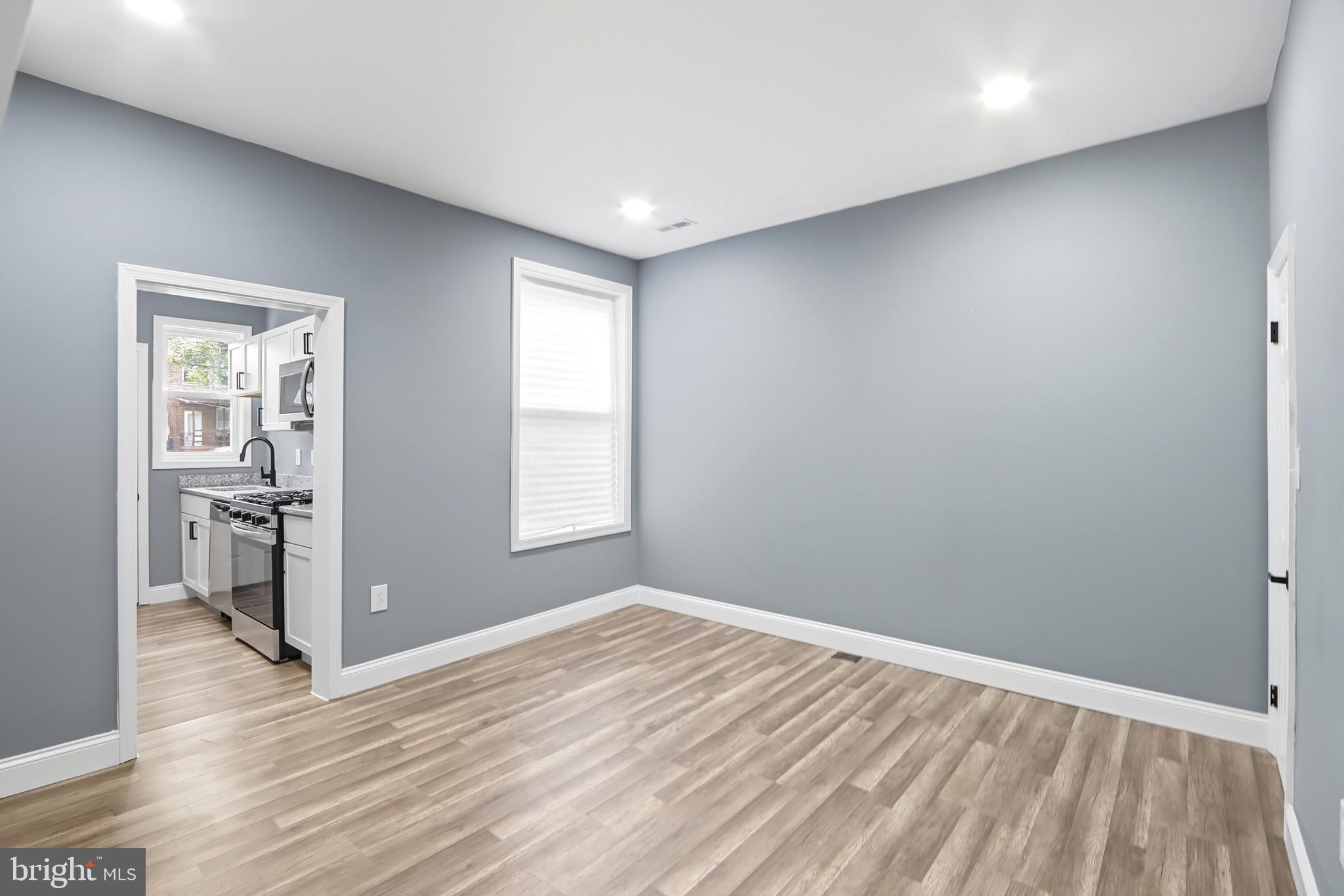 1309 East Patapsco Avenue Baltimore, MD 21225 - Photo 8 of 34 a view of empty room with wooden floor