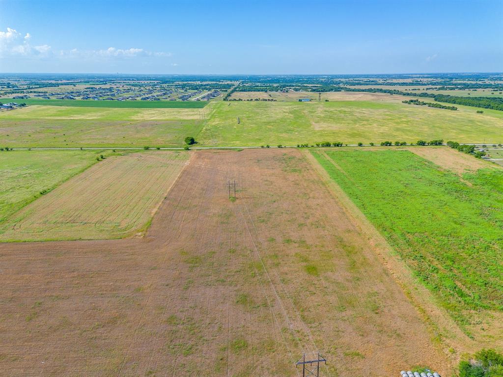 6785 Hoehn Road Valley View, TX 76272 - Photo 10 of 14 Expansive undeveloped land featuring a combination of tilled fields and grassy areas under a clear sky