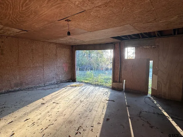 a view of a livingroom with furniture and windows