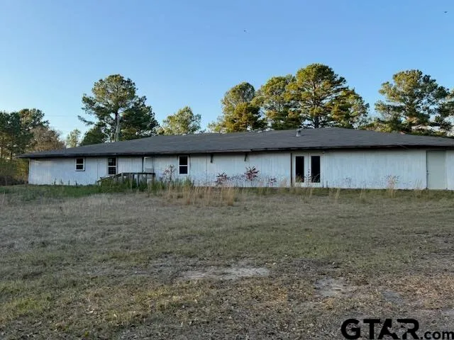 a view of a large body of water with a building in the background