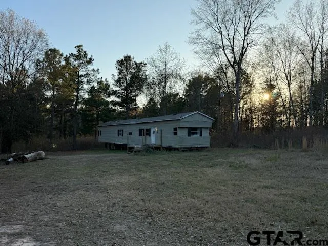 a kitchen with a sink and wooden cabinets