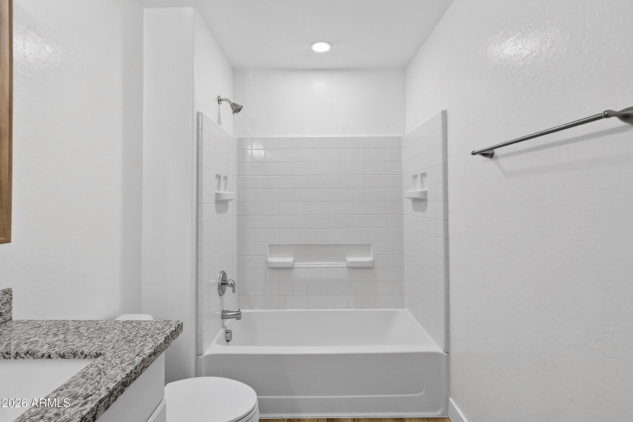 43620 West Cowpath Road Maricopa, AZ 85138 - Photo 50 of 60 a bathroom with a granite countertop tub sink and toilet