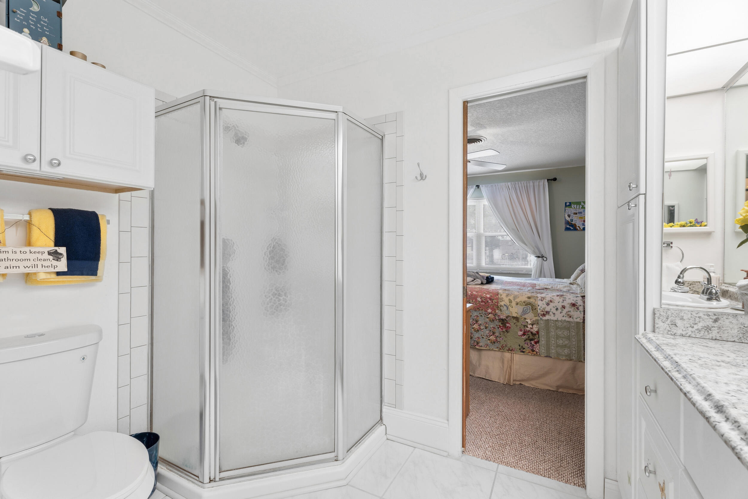 1341 Southeast Seashell Lane Stuart, FL 34996 - Photo 13 of 24 a bathroom with a granite countertop sink and a mirror