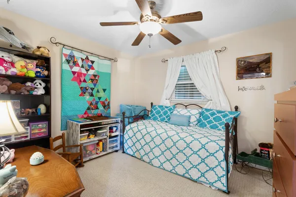 a bedroom with furniture and a couch