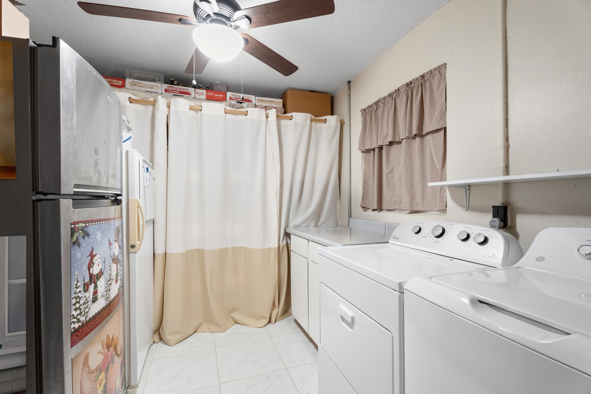 1341 Southeast Seashell Lane Stuart, FL 34996 - Photo 18 of 24 a utility room with dryer and washer