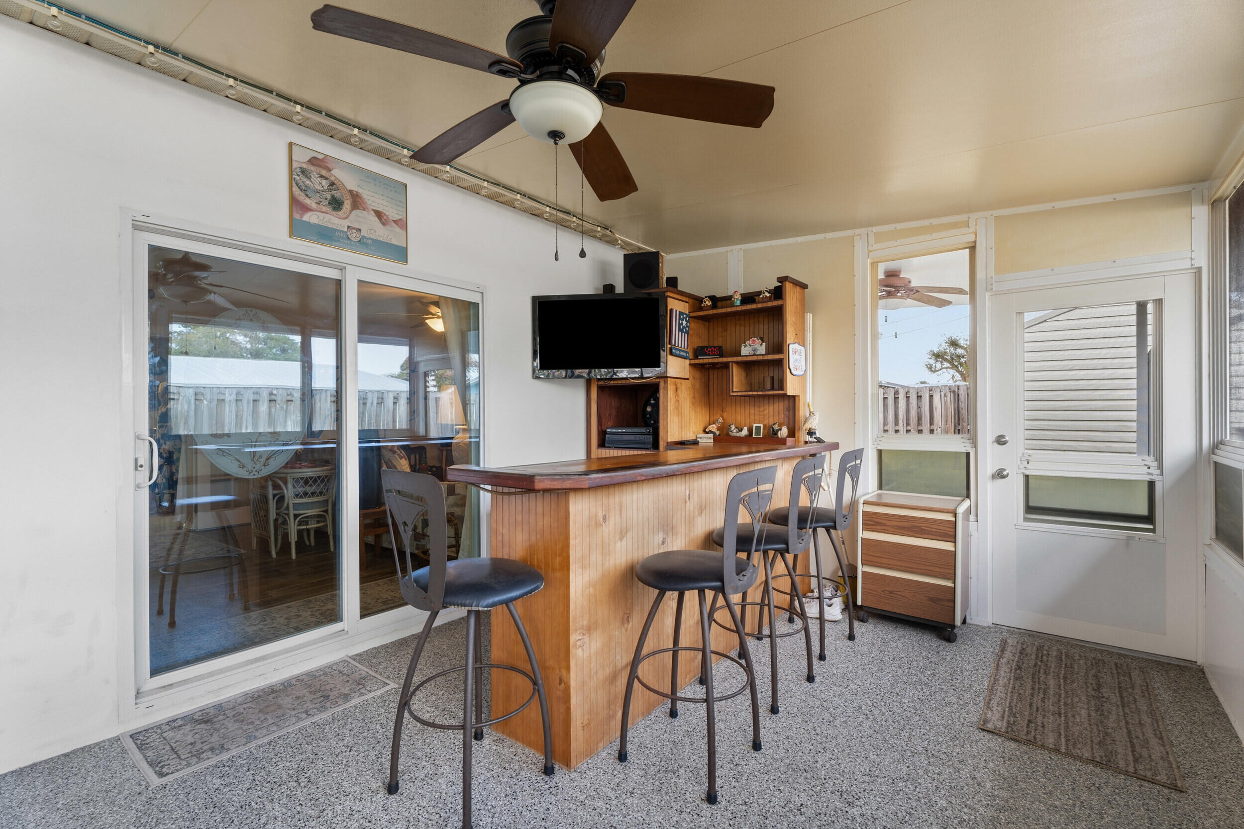 1341 Southeast Seashell Lane Stuart, FL 34996 - Photo 20 of 24 a dining room with furniture and a chandelier fan