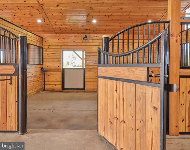 a front view of a house with a garden and garage