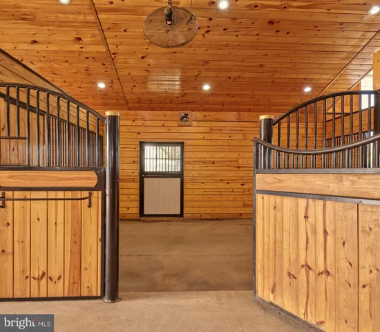 a aerial view of a house with swimming pool and lake view