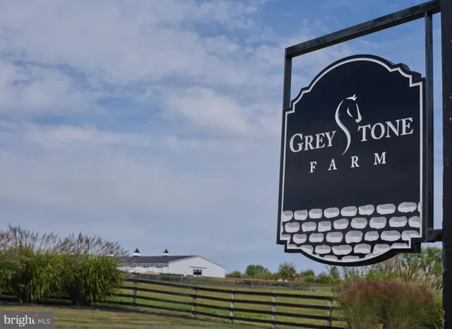 an aerial view of a house with big yard