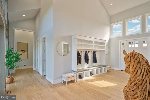 an aerial view of a house with a lake view