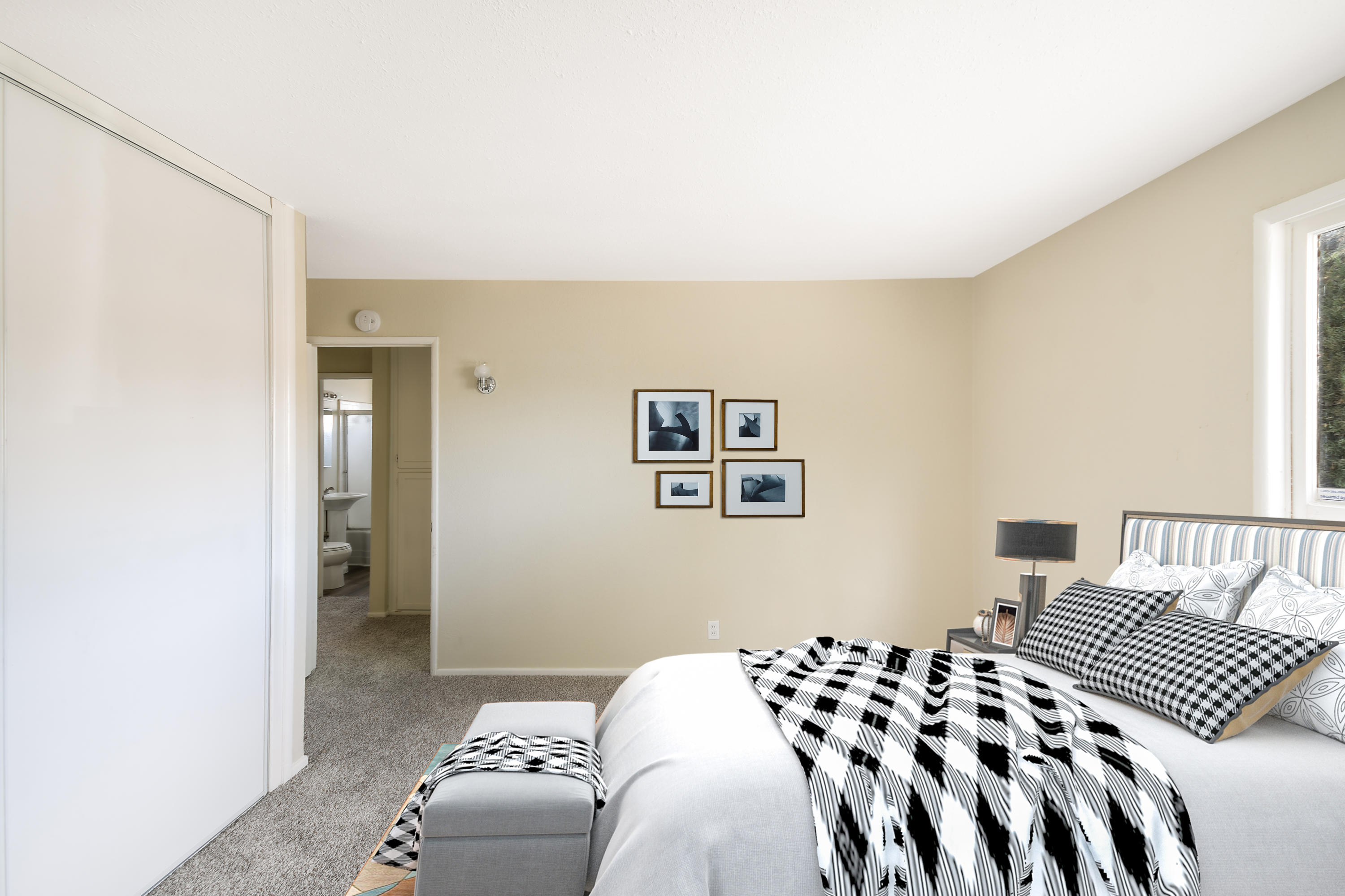 44325 3rd Street East Lancaster, CA 93535 - Photo 12 of 15 a bedroom with a bed and wall painting