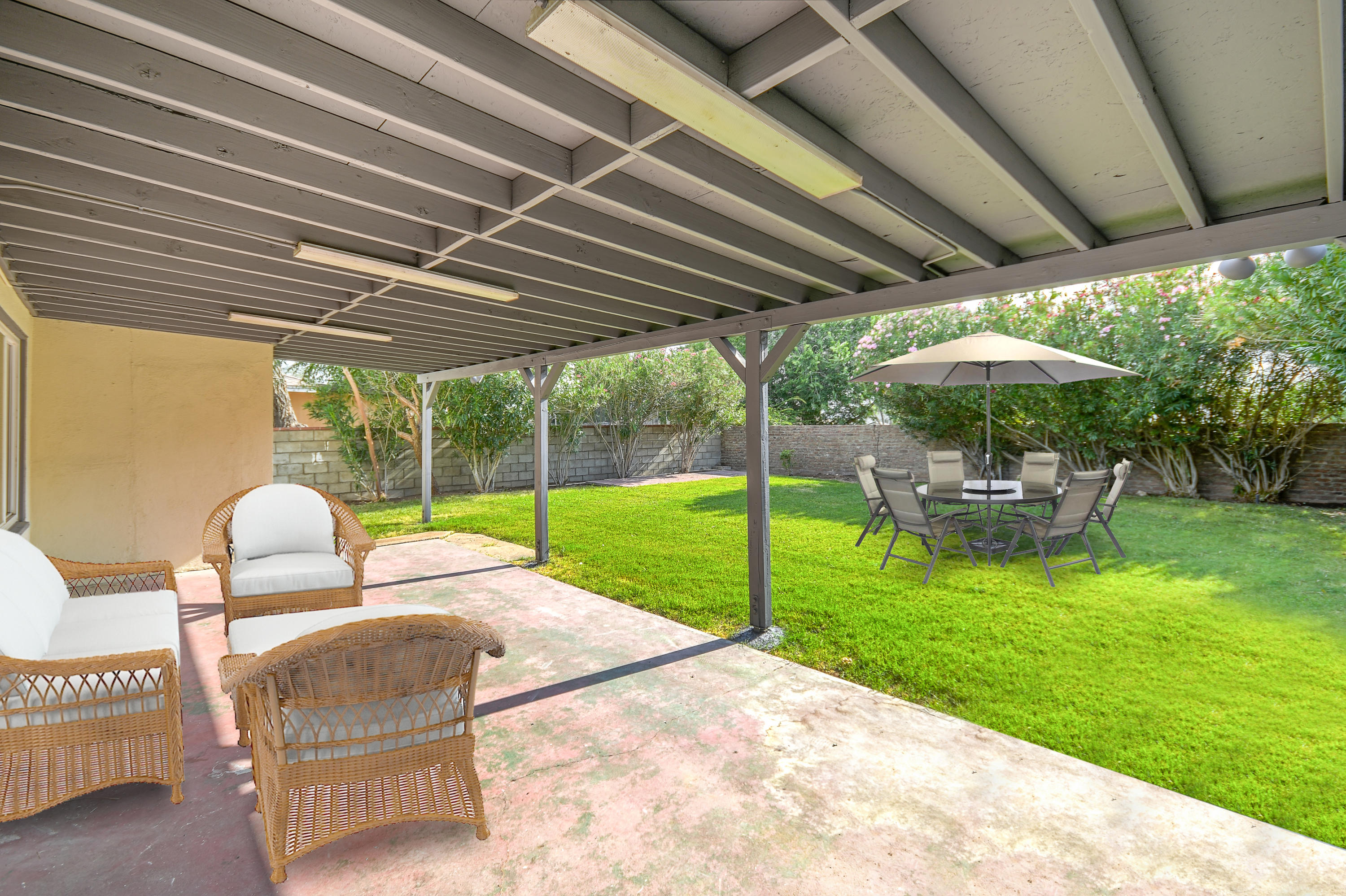 44325 3rd Street East Lancaster, CA 93535 - Photo 13 of 15 a garden view with a seating space