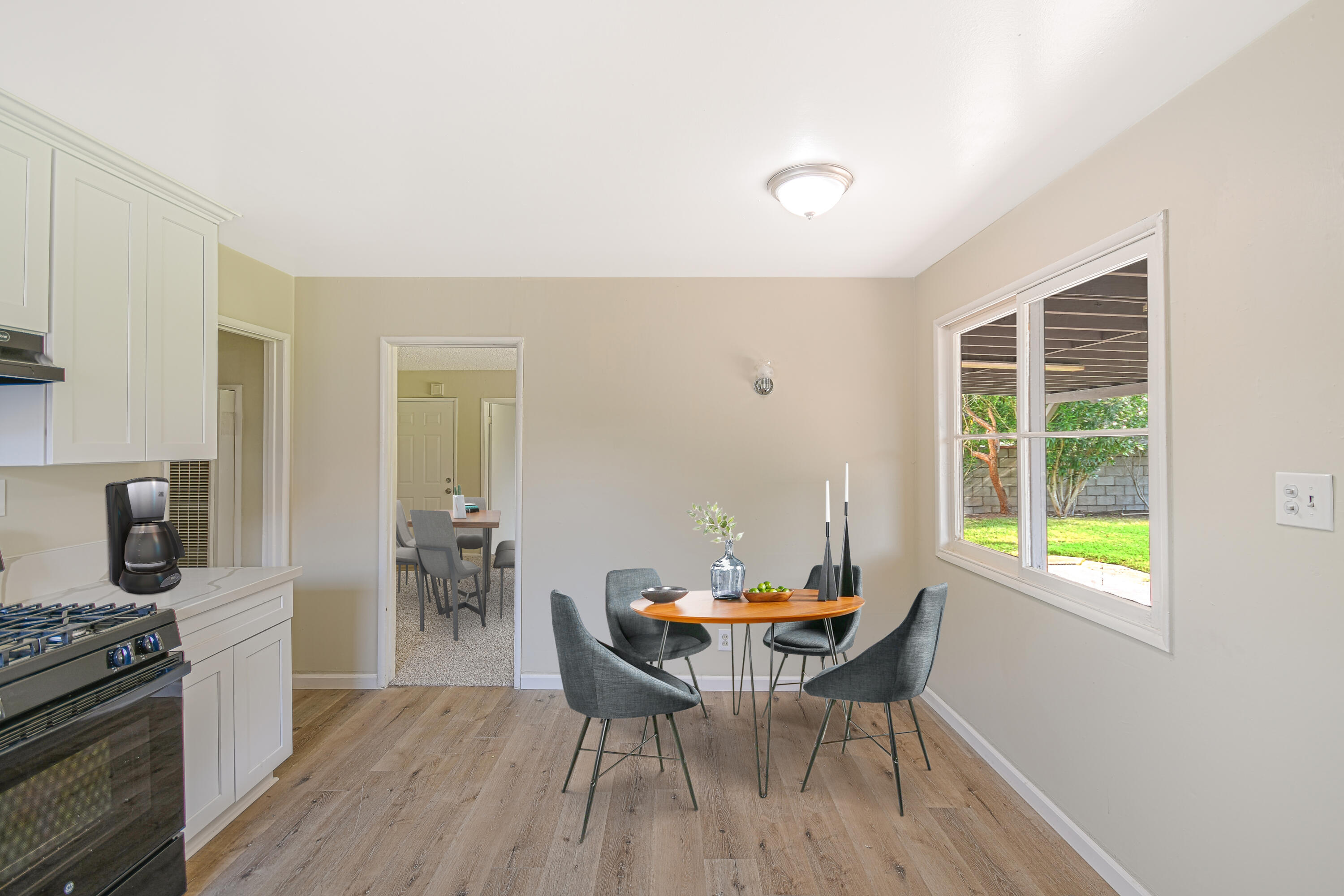 44325 3rd Street East Lancaster, CA 93535 - Photo 5 of 15 a view of a dining room with furniture window and wooden floor