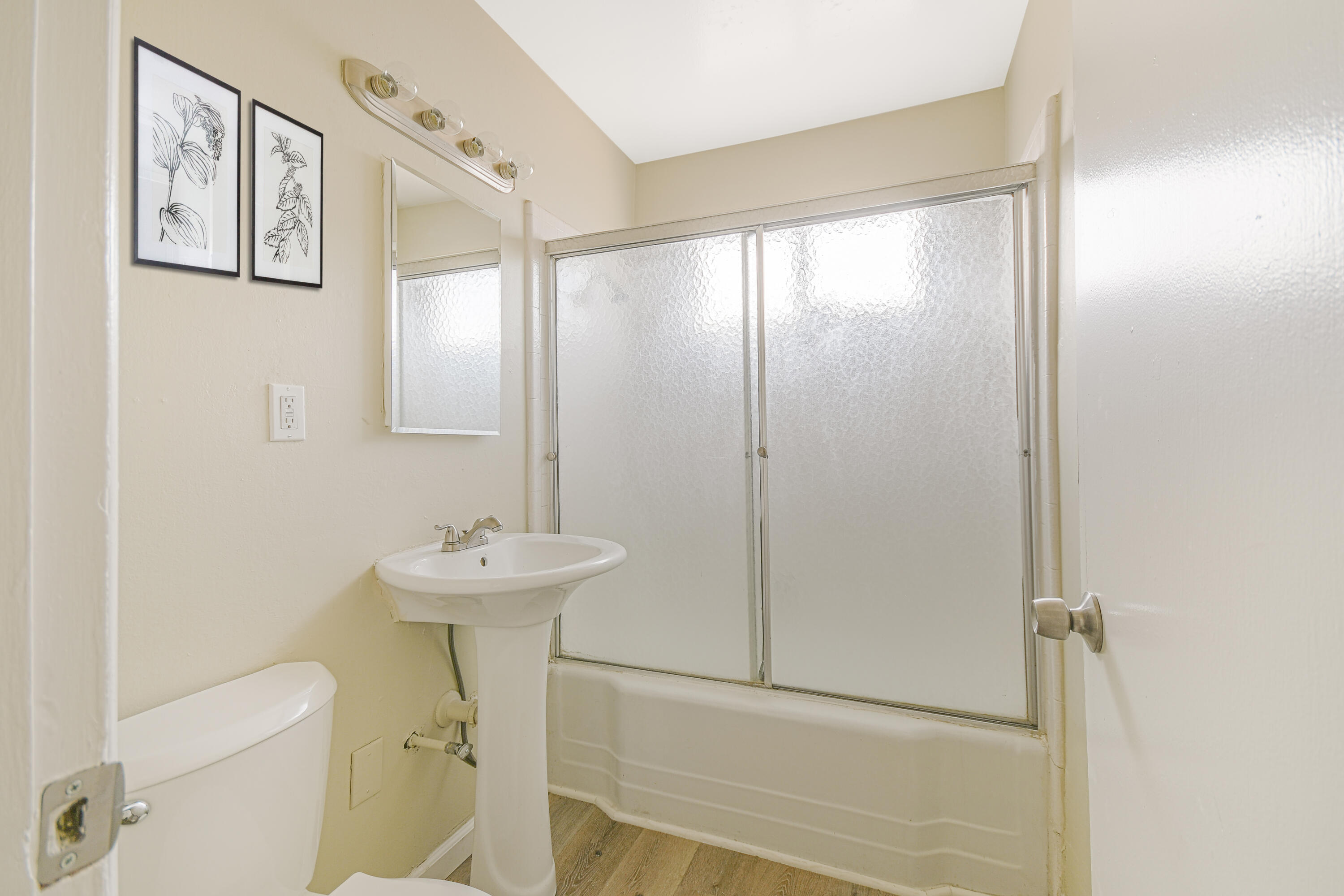 44325 3rd Street East Lancaster, CA 93535 - Photo 8 of 15 a bathroom with a sink mirror and a toilet