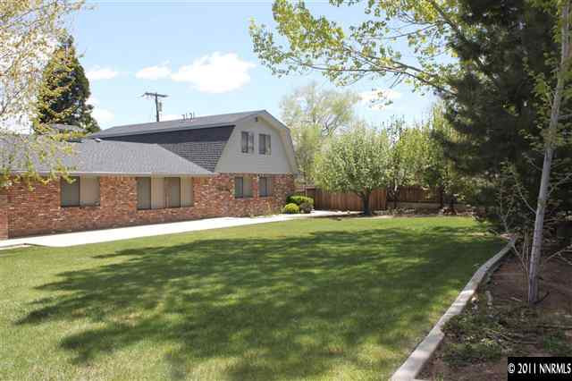 4215 Lakeside Drive Reno, NV 89509 - Photo 3 of 13 a front view of a house with a garden