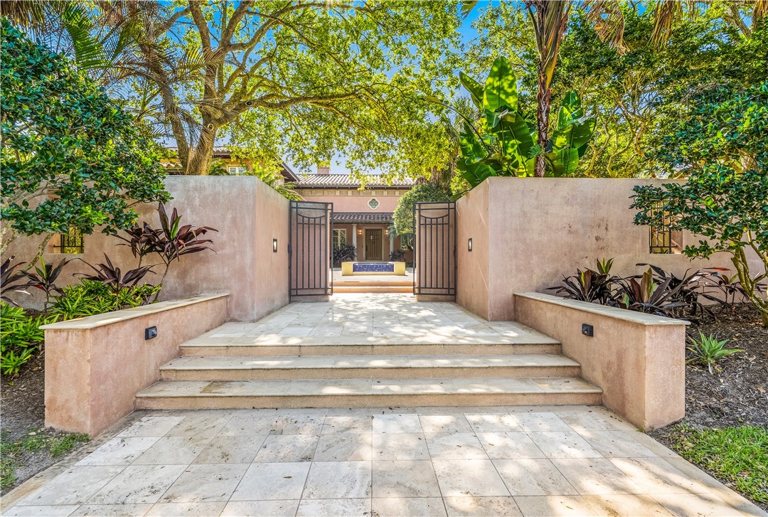 2350 Quay Dock Road Vero Beach, FL 32967 - Photo 8 of 35 a view of a white house with a sink and garden