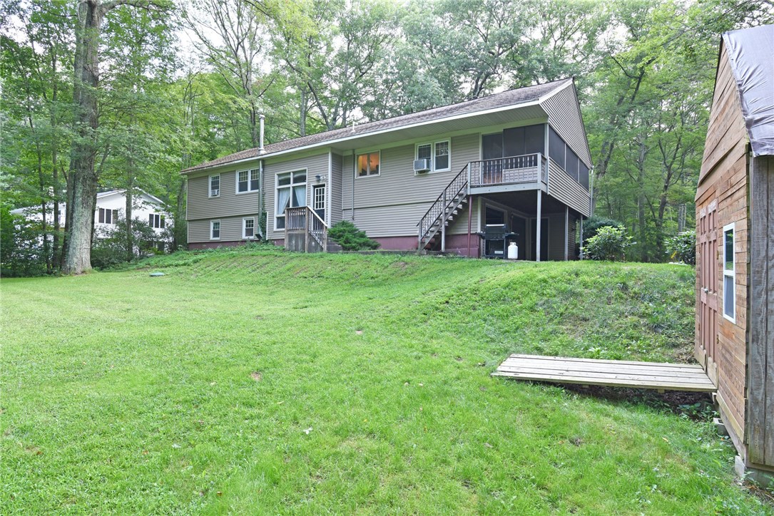 33 Ramble Road Glocester, RI 02857 - Photo 3 of 22 View from the backyard of the one acre lot.