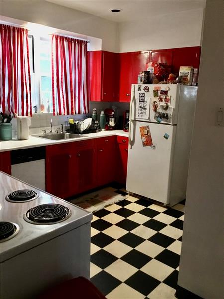 303 South Second Street Apollo, PA 15613 - Photo 13 of 25 a kitchen with a stove a refrigerator and a sink