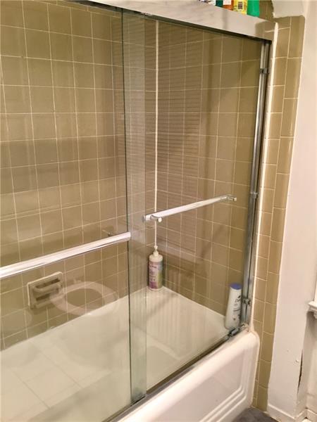 303 South Second Street Apollo, PA 15613 - Photo 16 of 25 a bathroom with a bathtub and a shower