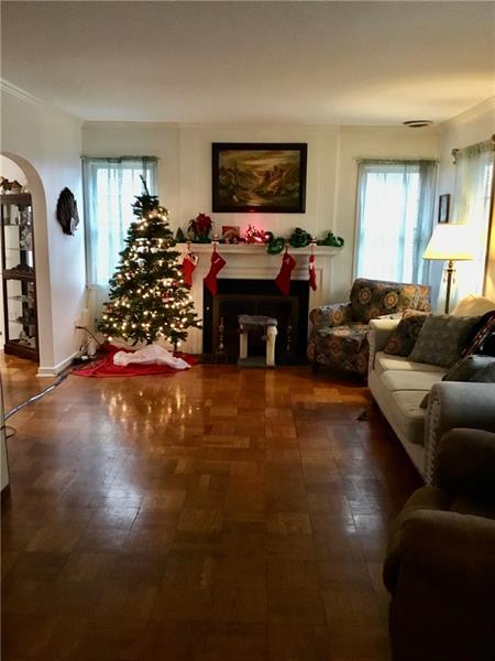 303 South Second Street Apollo, PA 15613 - Photo 8 of 25 a living room with furniture a flat screen tv and a fireplace