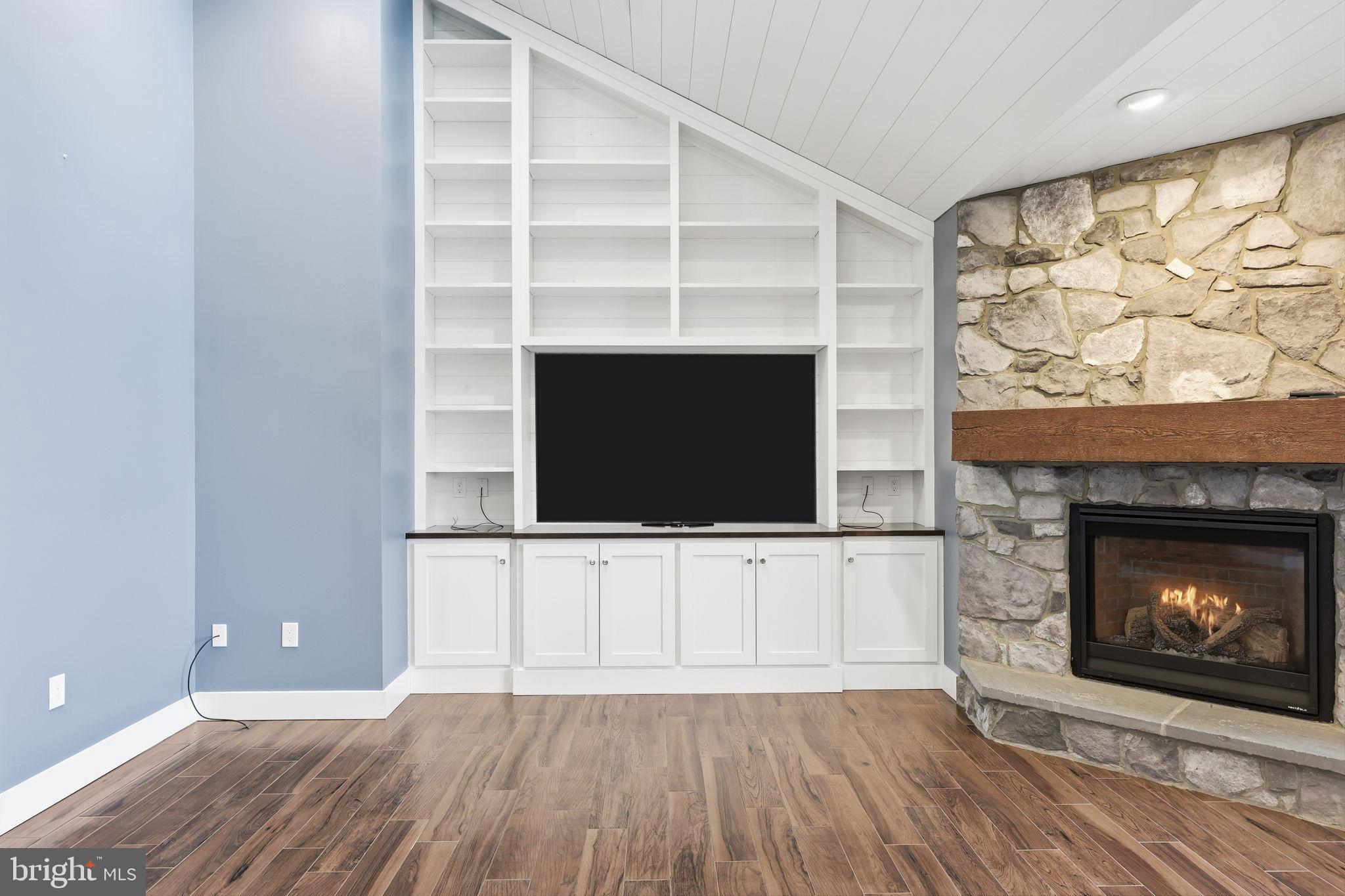 176 Fenstermaker Road Kutztown, PA 19530 - Photo 110 of 149 Modern living space with stone fireplace charm.