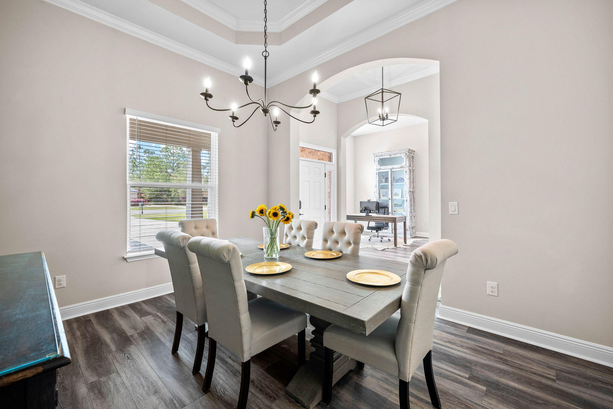 1297 Brushed Dune Circle Freeport, FL 32439 - Photo 12 of 73 a view of a dining room with furniture window and wooden floor