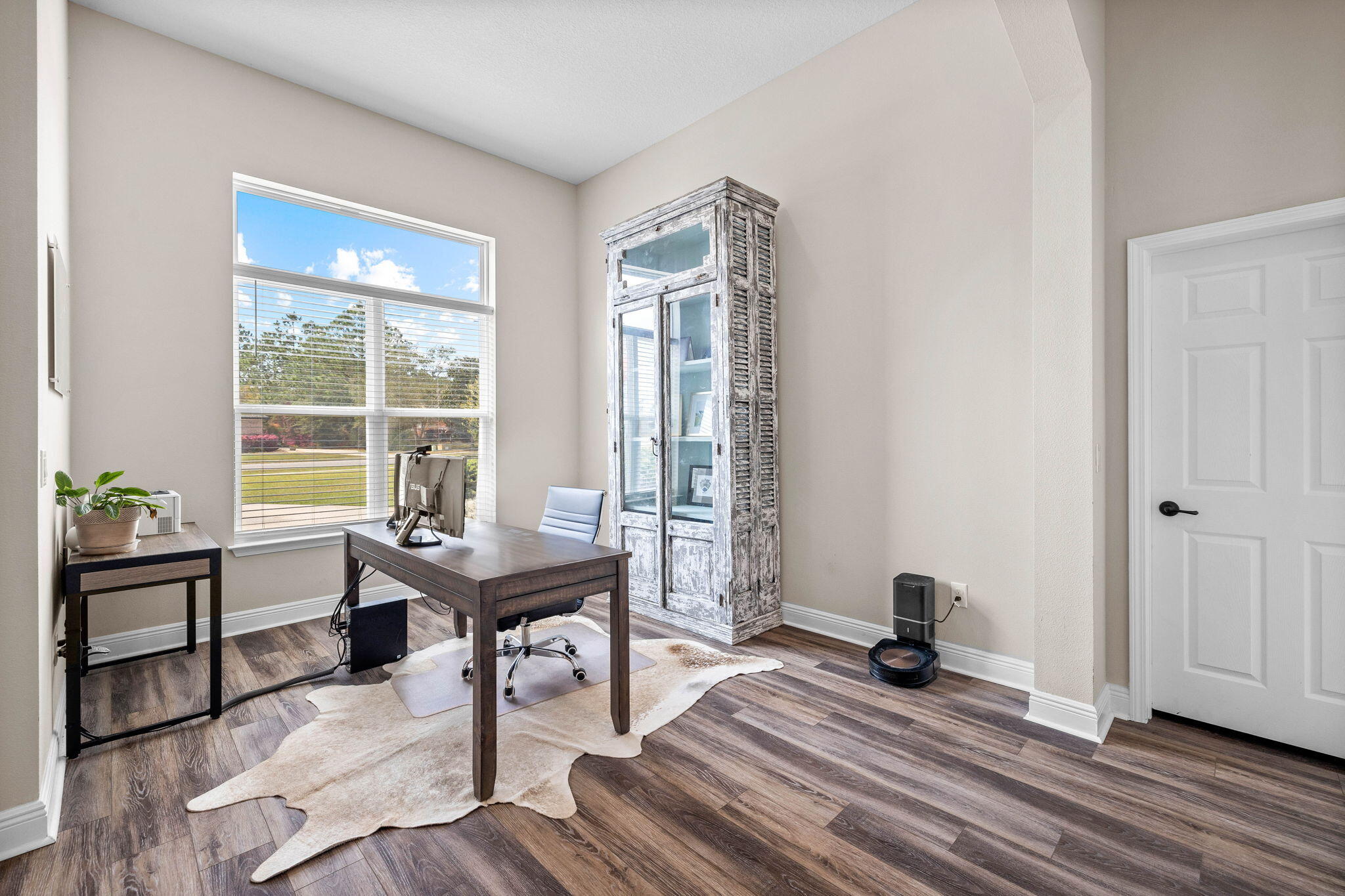 1297 Brushed Dune Circle Freeport, FL 32439 - Photo 14 of 73 a view of a workspace with furniture and a window