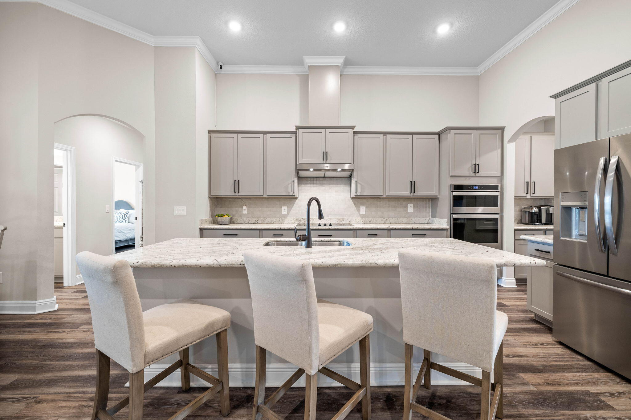 1297 Brushed Dune Circle Freeport, FL 32439 - Photo 21 of 73 a kitchen with stainless steel appliances granite countertop a dining table chairs refrigerator and sink