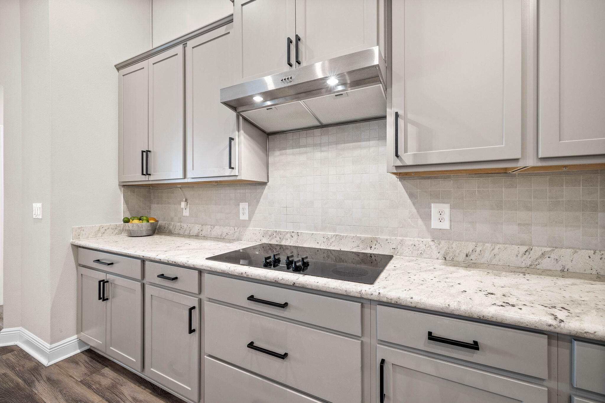 1297 Brushed Dune Circle Freeport, FL 32439 - Photo 22 of 73 a kitchen with granite countertop white cabinets and a stove