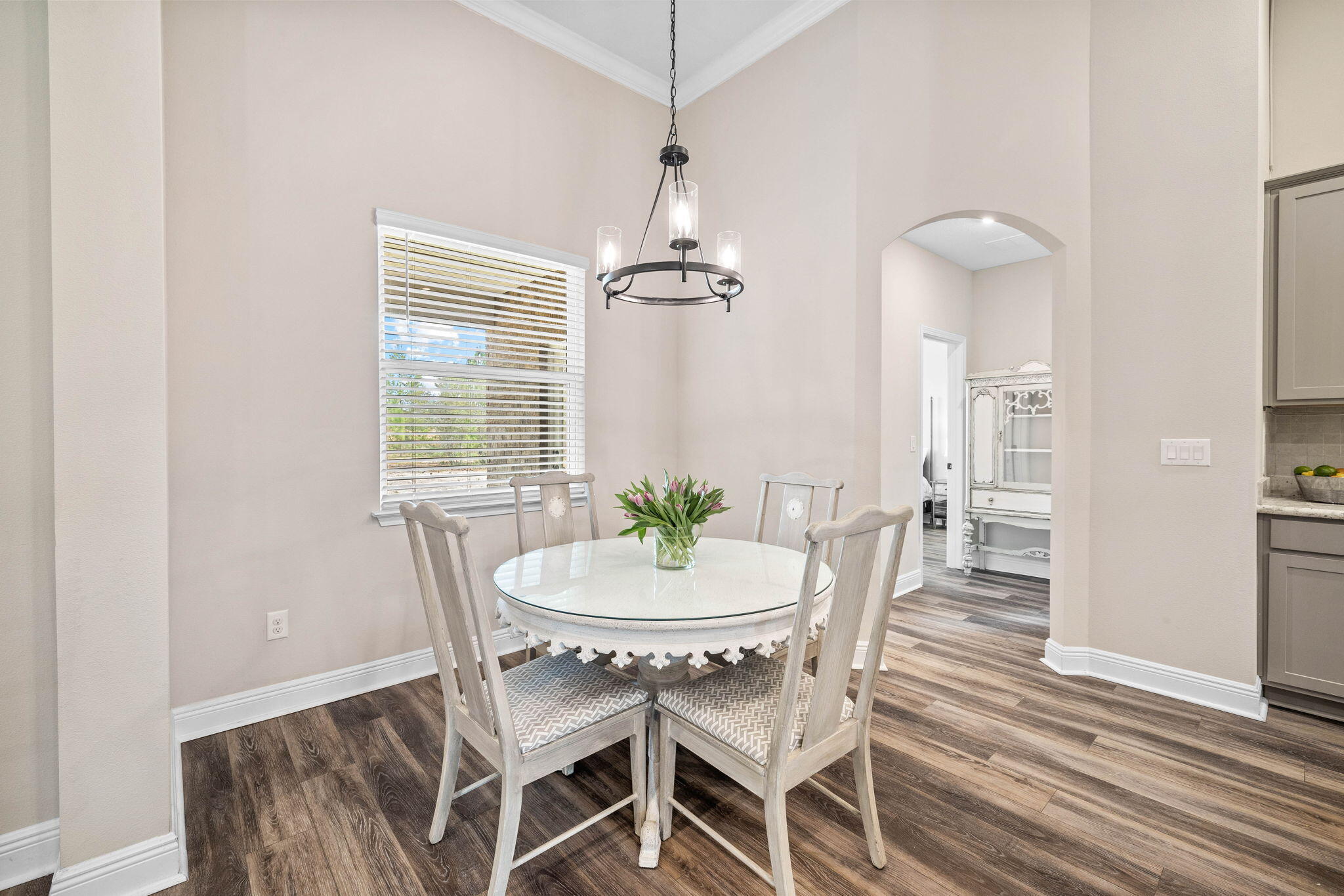 1297 Brushed Dune Circle Freeport, FL 32439 - Photo 24 of 73 a dining room with furniture a chandelier and wooden floor
