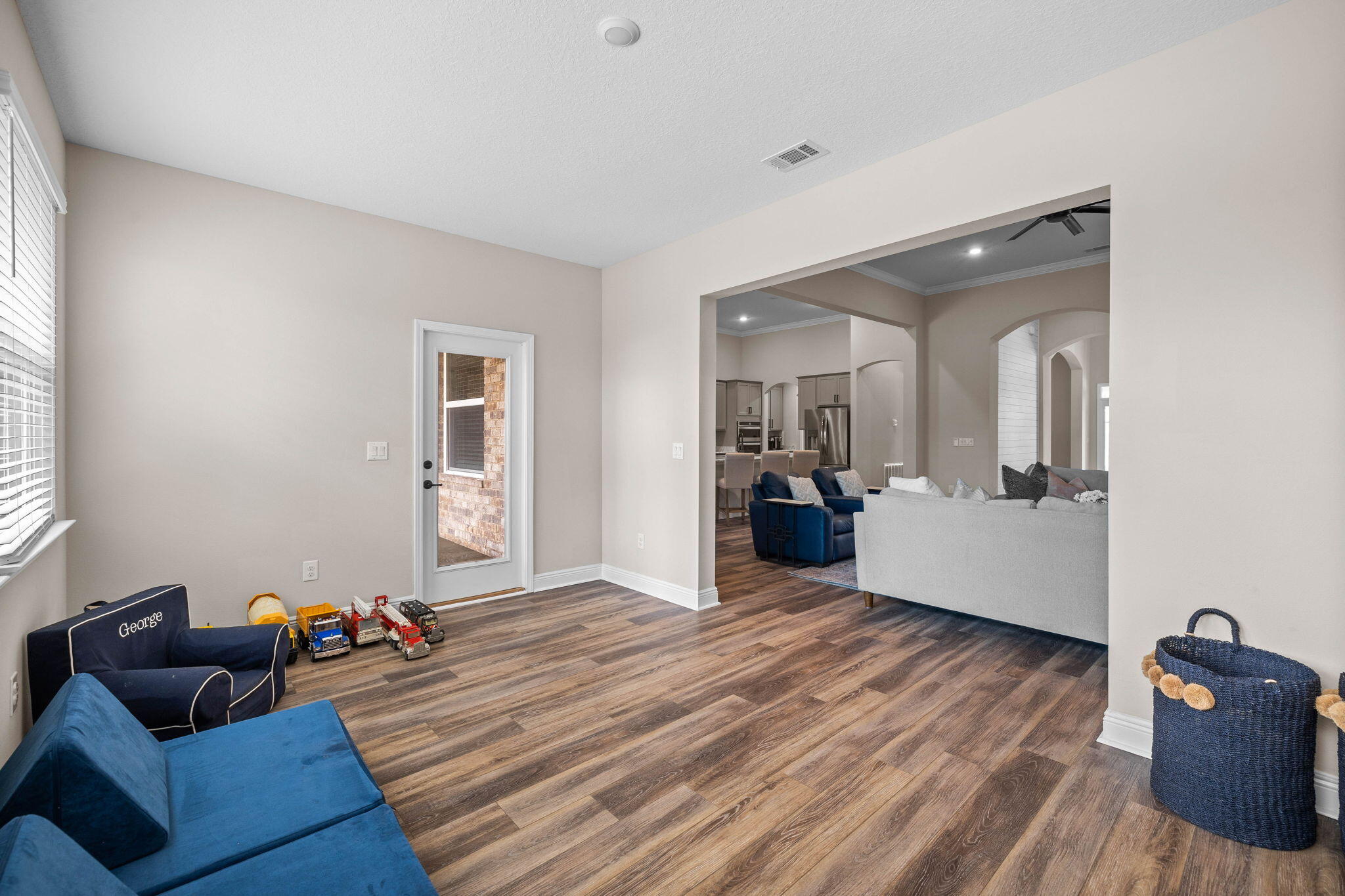 1297 Brushed Dune Circle Freeport, FL 32439 - Photo 27 of 73 a living room with furniture and a wooden floor